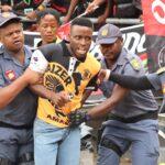 A Kaizer Chiefs fan removed form the field during the Soweto Derby at FNB Stadium. Photo By Ngcobo2010 Sharp Eye